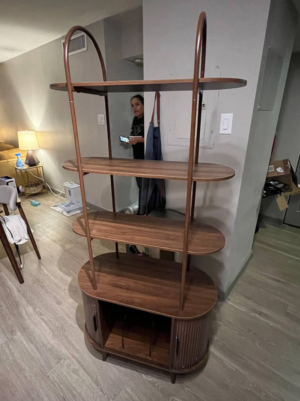 Designer walnut shelving unit assembled in Houston home